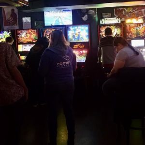 People playing pinball