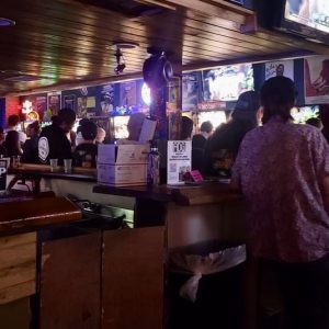 A line of pinball machines being played