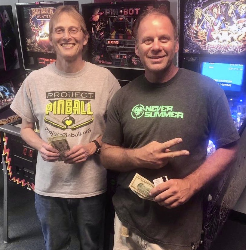 Dean with Mike in front of pinball machines