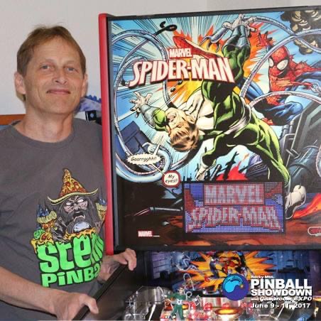 Dean Grover standing next to the Spider Man Pinball Machine